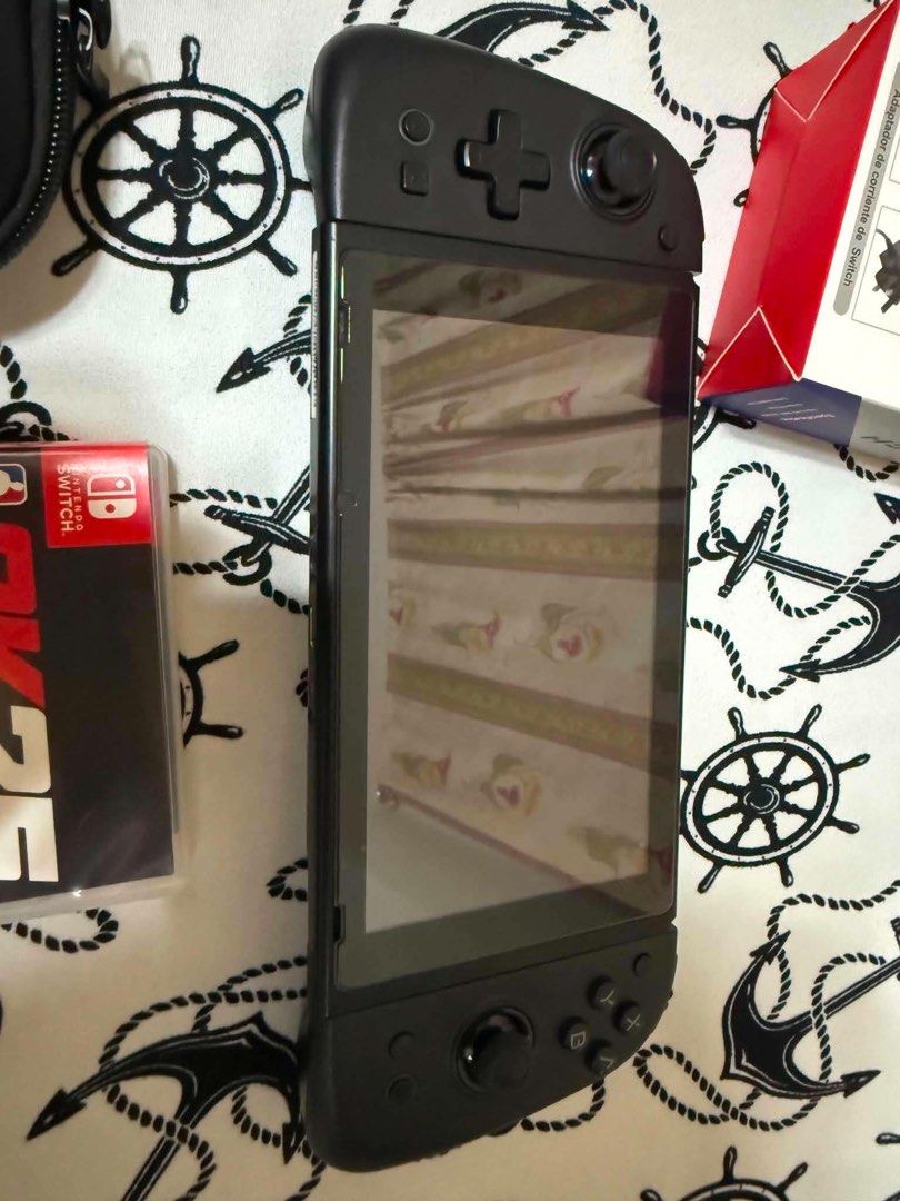 Nintendo Switch OLED V2 with Mobapad S1 Controller and Games (Category: Nintendo) located in Mandaluyong City. Submitted by jazmine_120 (Listing ID 1468613895, Image 2). Description: - Nintendo Switch OLED v2 console ready for immediate play - Includes premium black Mobapad S1 controller with original box - Comes with AC adapter and durable carrying case - Physical game cartridges included: NBA 2K25 and Assassin's Creed The Rebel Collection - All