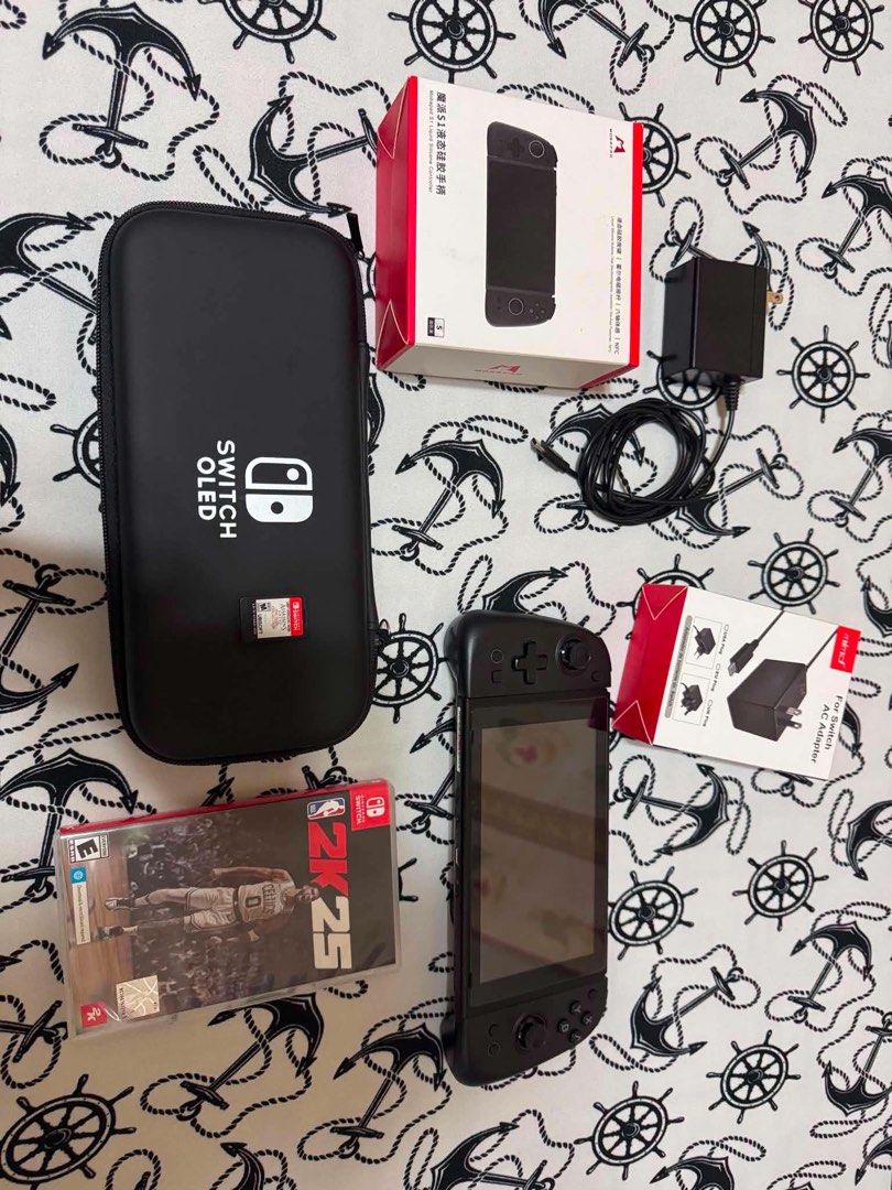 Nintendo Switch OLED V2 with Mobapad S1 Controller and Games (Category: Nintendo) located in Mandaluyong City. Submitted by jazmine_120 (Listing ID 1468613895, Image 1). Description: - Nintendo Switch OLED v2 console ready for immediate play - Includes premium black Mobapad S1 controller with original box - Comes with AC adapter and durable carrying case - Physical game cartridges included: NBA 2K25 and Assassin's Creed The Rebel Collection - All