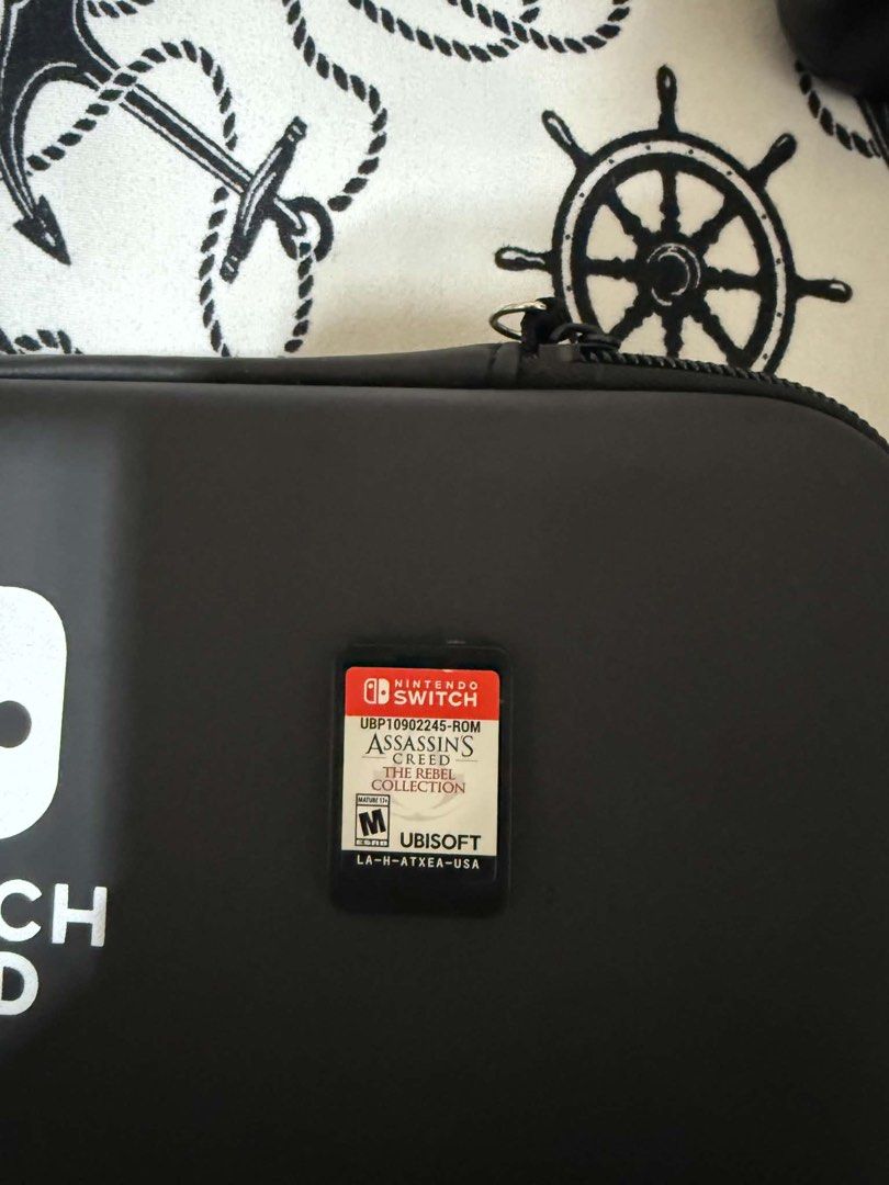Nintendo Switch OLED V2 with Mobapad S1 Controller and Games (Category: Nintendo) located in Mandaluyong City. Submitted by jazmine_120 (Listing ID 1468613895, Image 3). Description: - Nintendo Switch OLED v2 console ready for immediate play - Includes premium black Mobapad S1 controller with original box - Comes with AC adapter and durable carrying case - Physical game cartridges included: NBA 2K25 and Assassin's Creed The Rebel Collection - All