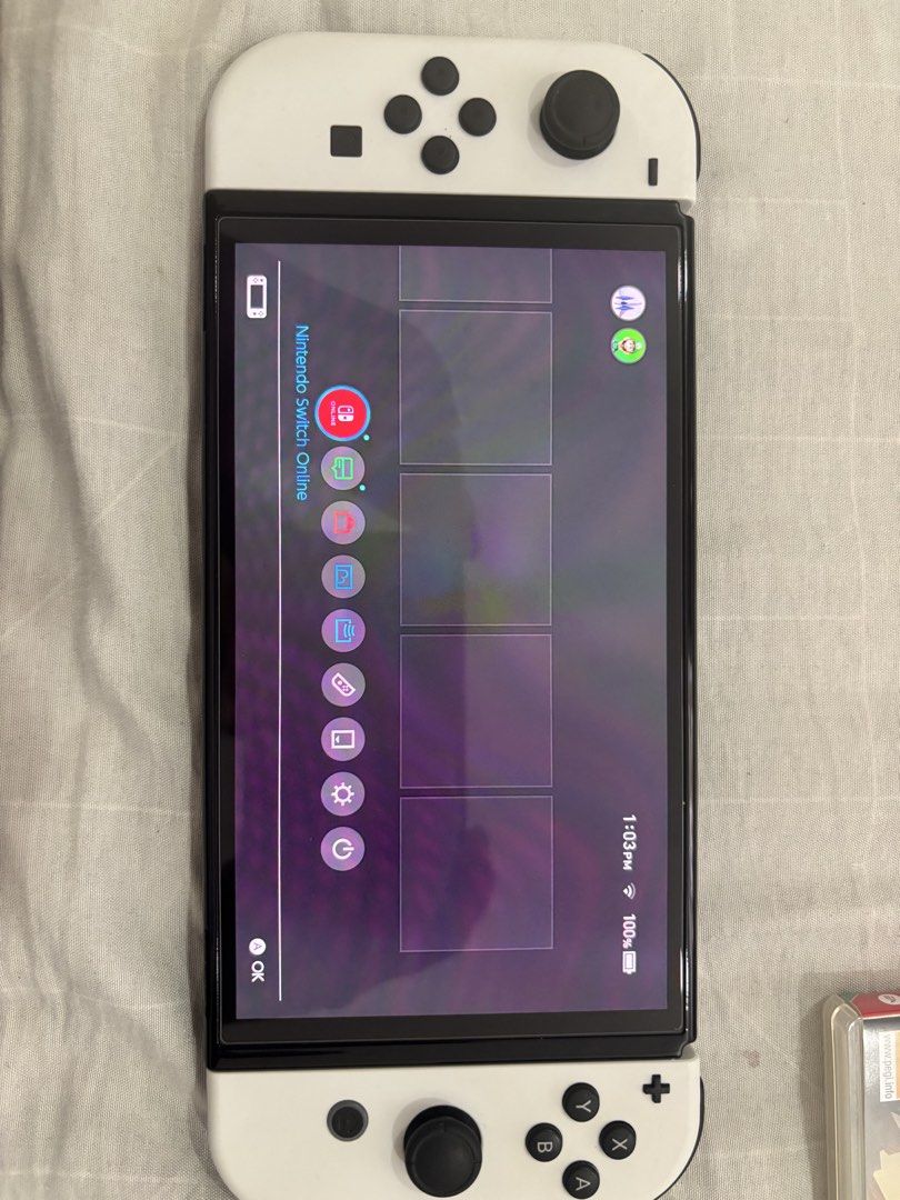 Nintendo Switch OLED White Console with Games and Case (Category: Nintendo) located in Floridablanca. Submitted by jmvbautista (Listing ID 1468543596, Image 2). Description: - Nintendo Switch OLED Model (White) in excellent, fully functional condition - Includes original box, TV dock, Joy-Con controllers, straps, and grip - Physical games included: The Legend of Zelda: Tears of the Kingdom and It Takes Two - Accessories included: Zelda-themed car