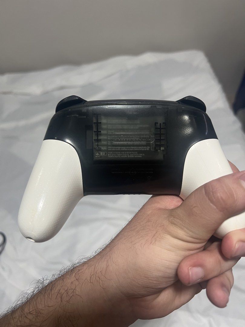 Nintendo Switch Pro Controller Super Smash Bros Edition (Category: Controllers) located in Cebu City. Submitted by swiftwater.9c307a (Listing ID 1468524392, Image 2). Description: - Official Super Smash Bros Ultimate Special Edition Pro Controller for Nintendo Switch - Stylish black translucent design with white grips and silver Smash logo - Fully wireless connectivity for comfortable gaming - Responsive dual thumbsticks, D-pad, and face buttons 