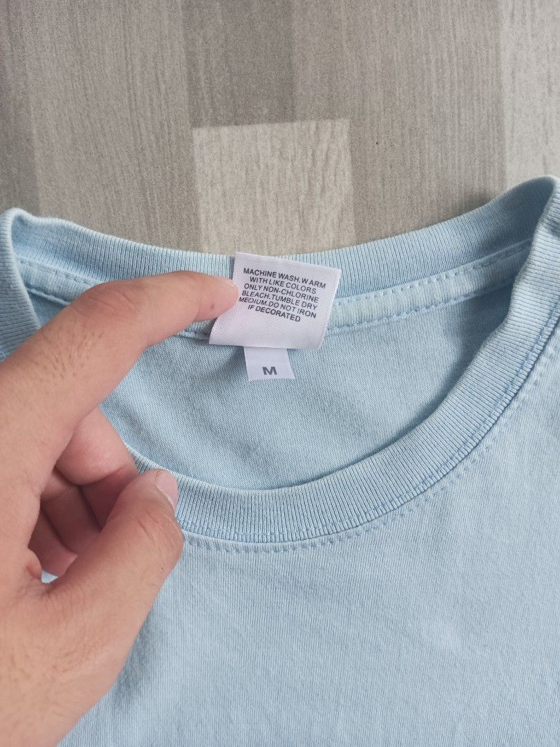 Noah NY Light Blue Fruit Graphic T-Shirt (Category: Tshirts & Polo Shirts ) located in Manila. Submitted by charleshustla (Listing ID 1468534574, Image 3). Description: - Brand: Noah - Color: Light blue with fruit graphic on chest - Material: 100% cotton (Made in Honduras) - Style: Classic crewneck, short sleeve t-shirt - Size: Medium.