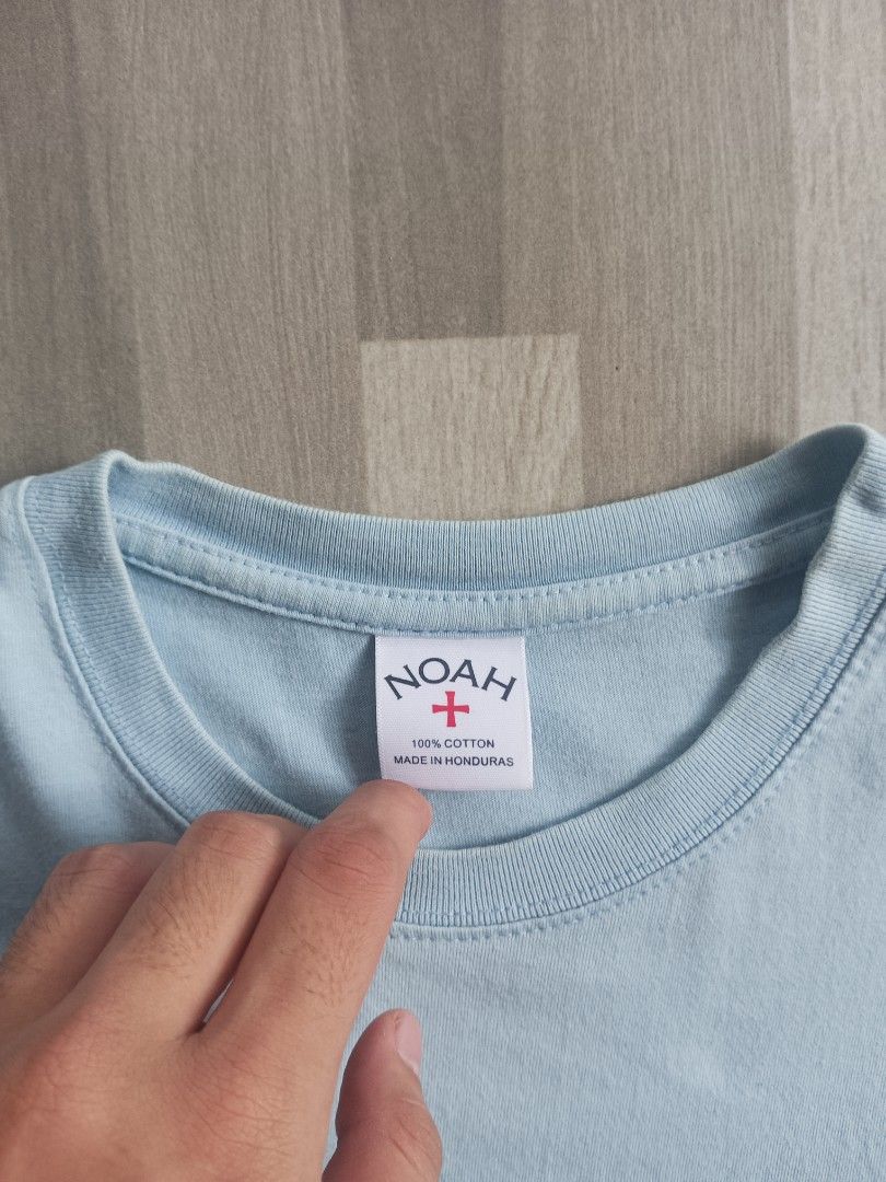 Noah NY Light Blue Fruit Graphic T-Shirt (Category: Tshirts & Polo Shirts ) located in Manila. Submitted by charleshustla (Listing ID 1468534574, Image 2). Description: - Brand: Noah - Color: Light blue with fruit graphic on chest - Material: 100% cotton (Made in Honduras) - Style: Classic crewneck, short sleeve t-shirt - Size: Medium.