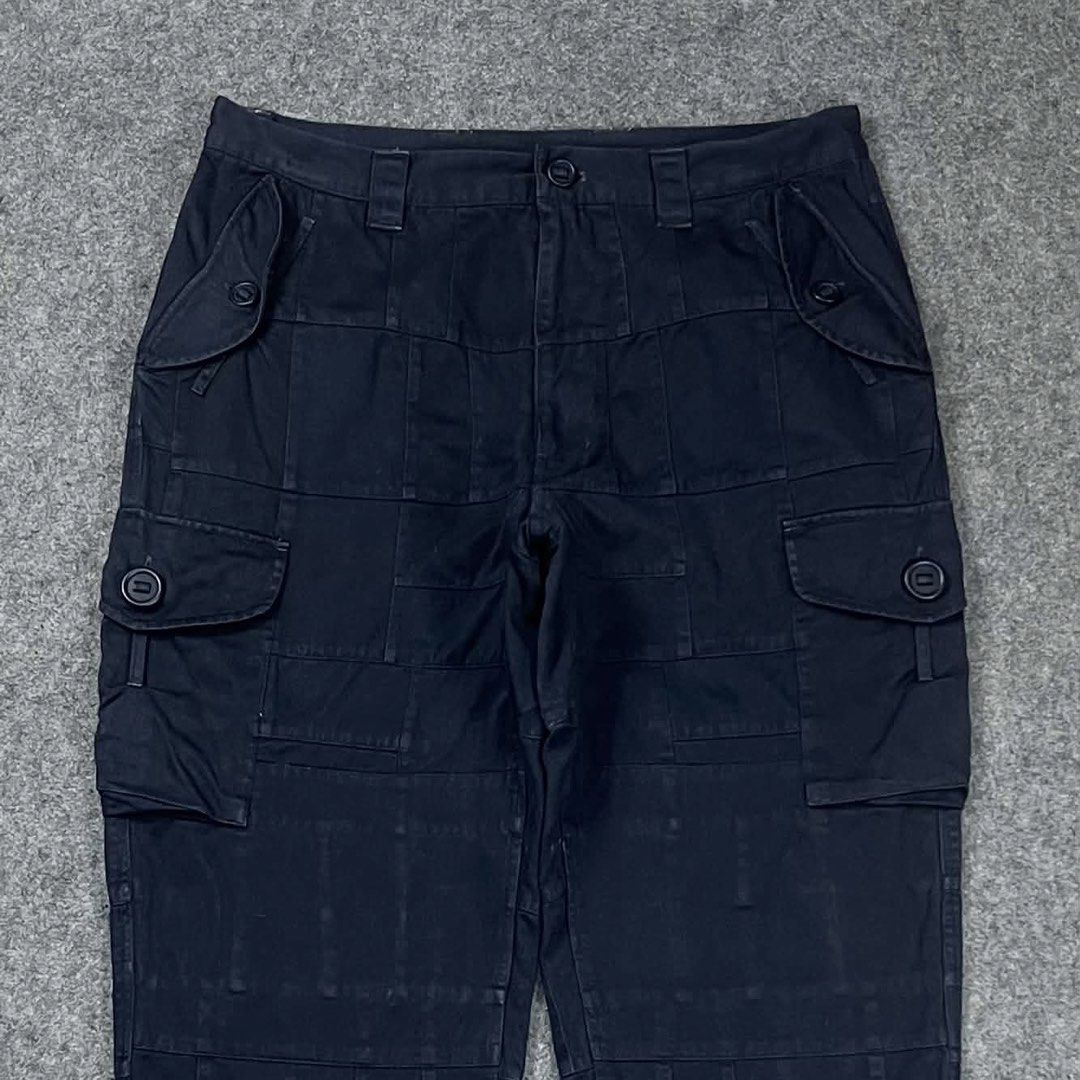 Nonnative Military Patchworks Cargo Pants (Category: Trousers) located in Zamboanga. Submitted by rag_20 (Listing ID 1468549834, Image 2). Description: Nonnative Military Patchworks Cargo Pants This Japanese brand is known for its high-quality military and workwear-inspired garments with hidden technical details. The fabric features an intricate grid pattern made from tonal squares and rectangles stitched together. Classic side cargo pockets with