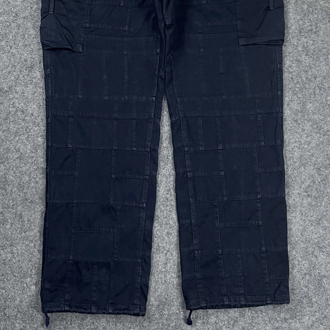 Nonnative Military Patchworks Cargo Pants (Category: Trousers) located in Zamboanga. Submitted by rag_20 (Listing ID 1468549834, Image 3). Description: Nonnative Military Patchworks Cargo Pants This Japanese brand is known for its high-quality military and workwear-inspired garments with hidden technical details. The fabric features an intricate grid pattern made from tonal squares and rectangles stitched together. Classic side cargo pockets with
