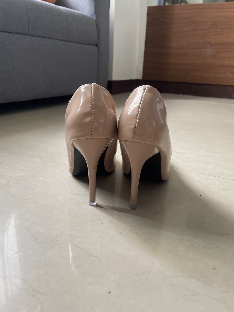 Nude patent leather pointed toe stiletto heels (Category: Heels) located in Quezon City. Submitted by thriftydreams (Listing ID 1468504618, Image 2). Description: - Classic nude patent leather stiletto heels - Elegant pointed toe design with a high, slim heel - Versatile neutral shade that matches any outfit for work or dinner - Clean interior lining with a glossy outer finish - Easy slip-on style.