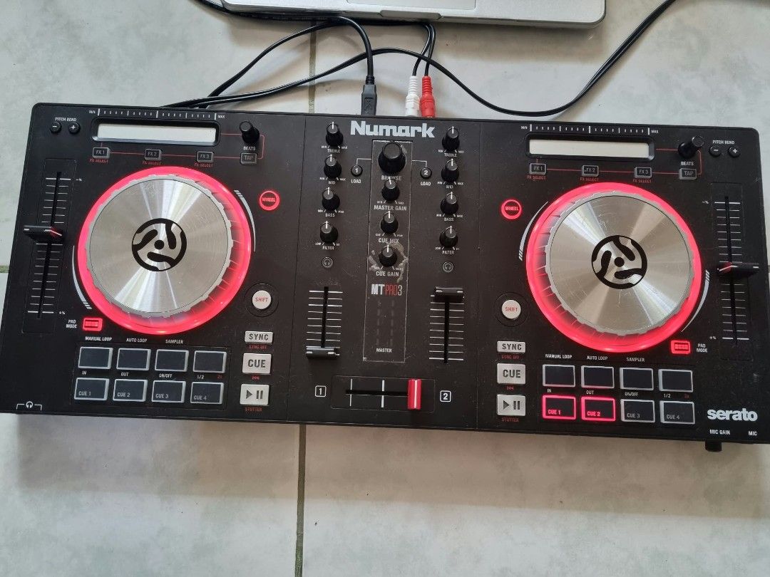 Numark Mixtrack Pro 3 DJ Controller (Category: Controllers) located in Angeles City. Submitted by roshangaming (Listing ID 1468569855, Image 1). Description: - Model: Numark Mixtrack Pro 3 (for Serato DJ) - Features: Dual decks with metal jog wheels, pitch sliders, performance pads, and central mixer section - Condition: Normal signs of use on the chassis, fully working - Inclusions: USB cable, RCA audio output cables - Ports: Front panel headpho