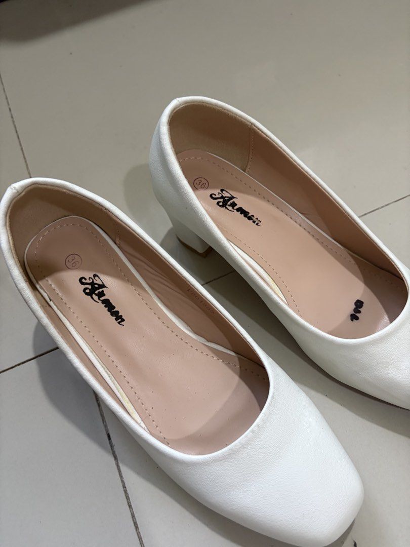 Nursing Heels (Category: Heels) located in Quezon City. Submitted by pandesauuur (Listing ID 1468564746, Image 3). Description: - Brand/Model: Aimen white block heels - Size: 36 (stamped inside) - Heel: Chunky and very easy to walk in - Toe Shape: Rounded square toe - Lining: Light beige inner lining - Condition: Clean overall with minor scuff marks near the back side.