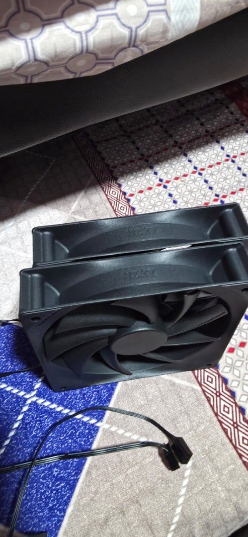 NZXT 120mm Black PC Case Fans Pair (Category: Computer Parts) located in Singapore. Submitted by atomizer22 (Listing ID 1468510927, Image 3). Description: - Quantity: 2 black NZXT case fans $5 each - Condition: New, fully working (pulled from a new casing) - Design: Standard square frame with multi-blade setup - Connection: Attached cables with standard fan connectors - Best for: Reliable airflow in standard desktop builds - Self-collection or ma
