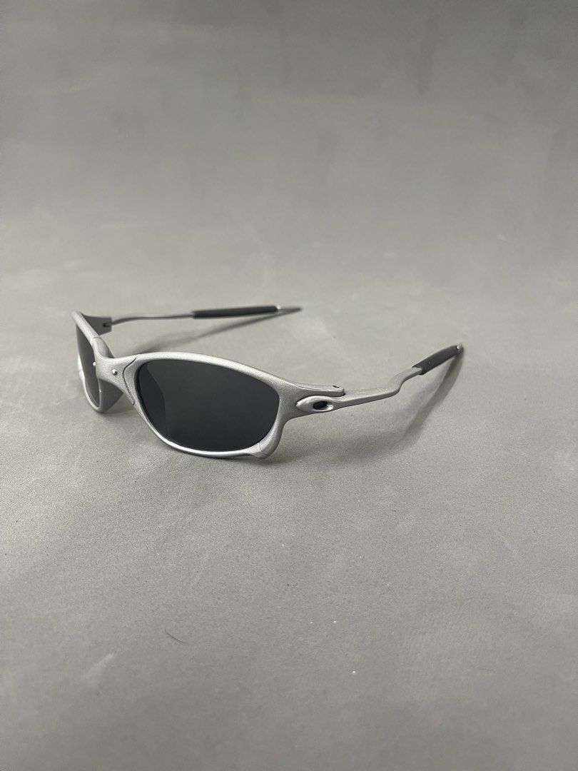 Oakley Juliet Sunglasses Silver Black (Category: Strollers) located in Manila. Submitted by mine2ownit (Listing ID 1468591290, Image 2). Description: - Model: Oakley Juliet sunglasses - Frame: Durable silver metal frame with iconic futuristic design and distinct nose bridge hardware - Lenses: Dark black lenses, perfect for outdoor wear - Details: Features comfortable rubber ear stems and solid build quality - Condition: Great daily shades, ideal 