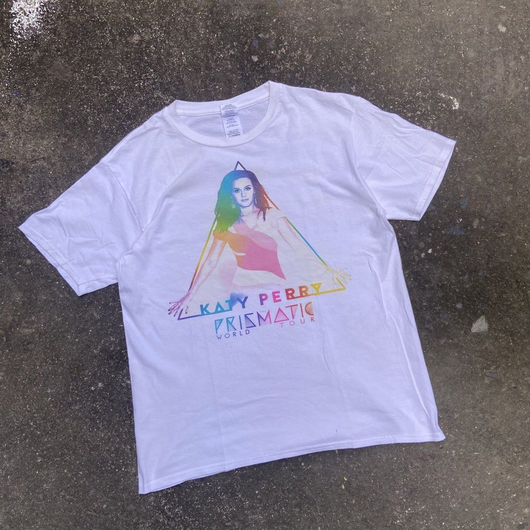 Official Katy Perry “The Prismatic World Tour” Tee (Category: Shirts) located in Angeles City. Submitted by eriellynnthrifts (Listing ID 1468630863, Image 1). Description: 19x25 S on tag Good Condition. See photo for details 350 Angeles City Pampanga.