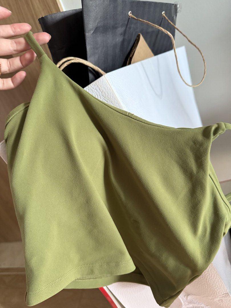 Olive Green Activewear Crop Top (Category: Activewear) located in Mandaluyong City. Submitted by declutteringmylife101 (Listing ID 1468577109, Image 1). Description: - Color: Olive green - Style: Activewear crop top with built-in support - Material: Soft and stretchy fabric - Versatility: Great for workouts, yoga, or everyday casual wear - Matching: Easy to pair with high-waisted leggings or shorts - Home: Clean, smoke-free environment.