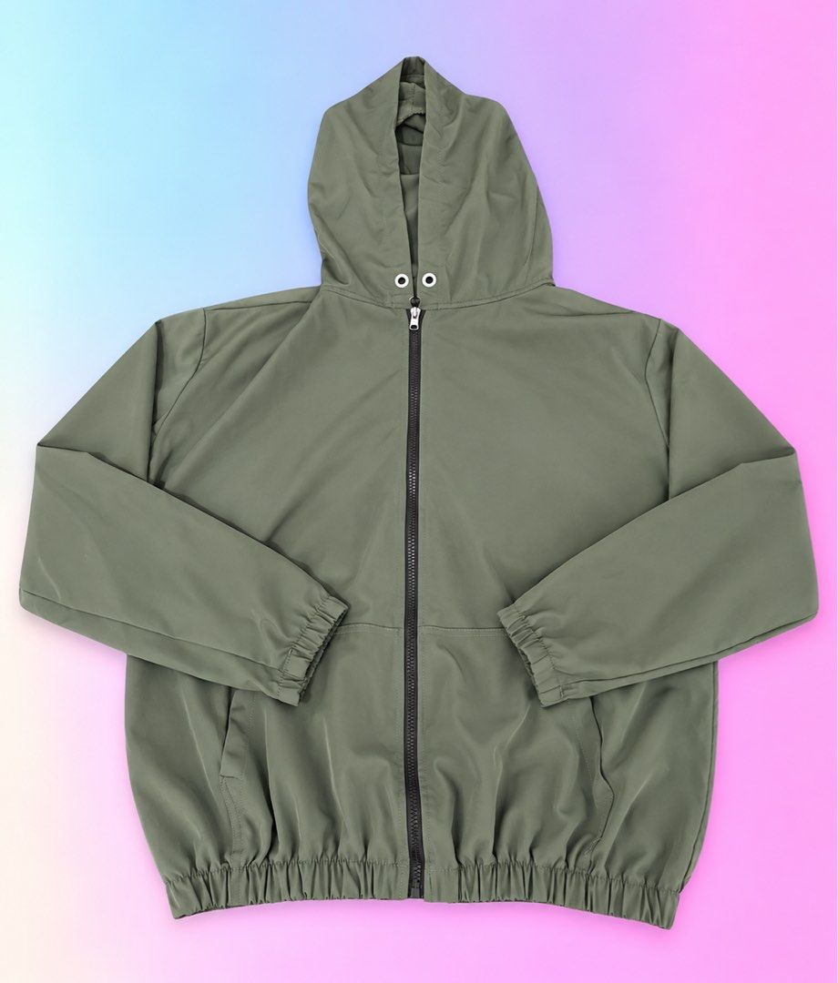 Olive green hooded zip-up windbreaker jacket (Category: Coats, Jackets and Outerwear) located in Quezon City. Submitted by turtleandfishes (Listing ID 1468629723, Image 1). Description: - Color: Olive green - Style: Full-zip jacket with built-in hood and chin drawstrings - Comfort: Elasticized cuffs and gathered elastic hem for a snug fit - Pockets: Two functional side welt pockets - Fabric: Lightweight and easy to throw on for breezy days.