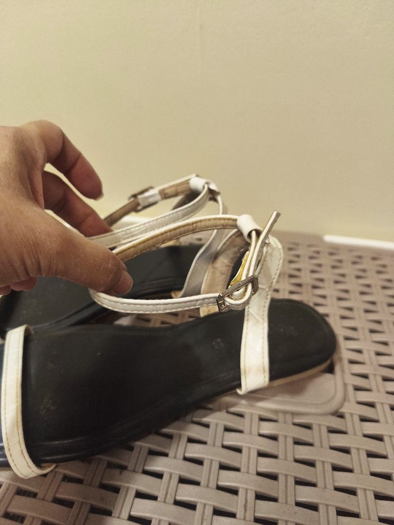 Olivia White and black flat sandals with ankle strap (Category: Flats & Sandals) located in Baguio. Submitted by zia_zab (Listing ID 1468530700, Image 3). Description: - Color: Classic black with a contrast white front strap - Design: Trendy square toe with secure ankle strap and buckle closure - Style: Simple, versatile flat sandals perfect for everyday casual outfits - Condition: Pre-loved with visible signs of wear and dirt on the soles - Budg