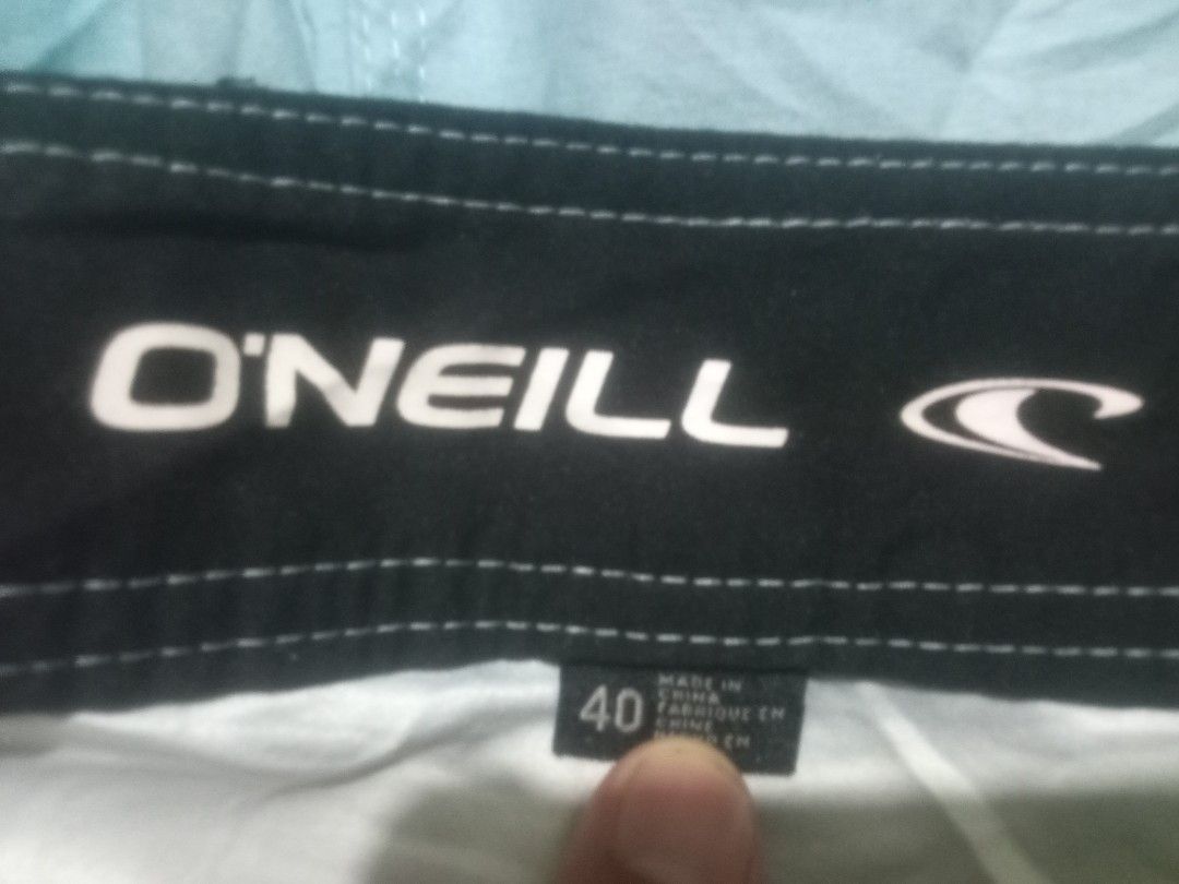 O'Neill Light Blue Board Shorts Size 40 (Category: Swim Trunks & Board Shorts) located in Manila. Submitted by boot_tdm (Listing ID 1468707102, Image 1). Description: - Brand: O'Neill - Color: Light Blue - Size: 40 - Waist: Drawstring closure for an adjustable fit - Pockets: Convenient side cargo pocket with flap closure - Details: Large O'Neill text branding printed on the leg - Ideal for: Beach trips, pool days, and casual swimwear - Origin: Ma