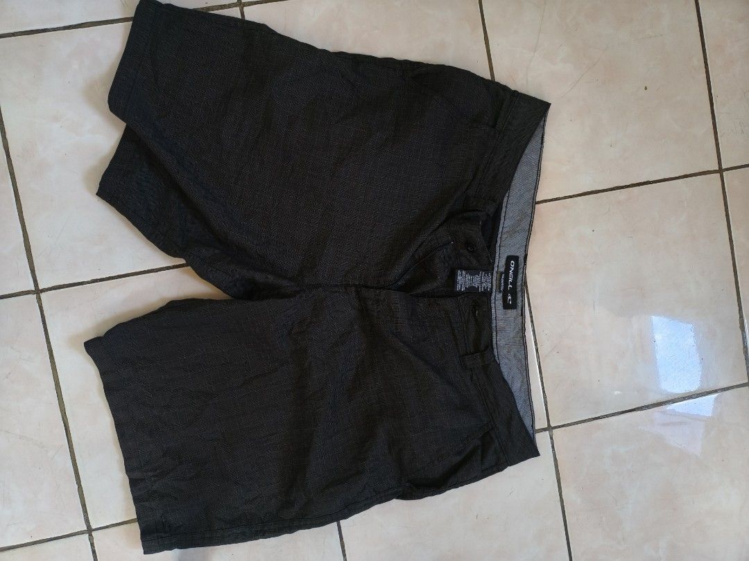 O'Neill Men's Black Patterned Shorts Size 36 (Category: Shorts) located in Munoz. Submitted by toy_zone (Listing ID 1468503127, Image 1). Description: - Brand: O'Neill - Color: Dark grey patterned - Size: 36 waist - Material: 78% polyester, 21% viscose, 1% elastane blend (Made in India) - Closure: Button closure with zipper fly - Pockets: Two back pockets with secure button flaps - Condition/Use: Perfect for comfortable, everyday casual wear.
