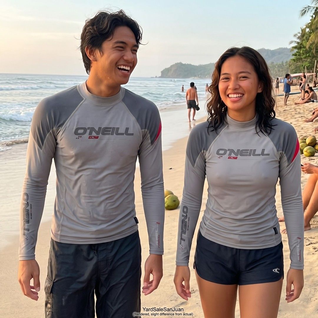 O'Neill Ozone Tech Long Sleeve Rash Guard Grey Red (Category: Water Sports) located in San Juan City. Submitted by YardSaleSanJuan (Listing ID 1468711751, Image 2). Description: - Brand: O'Neill (Ozone Tech Travel Series) - Color: Grey with red shoulder accents - Design: Long sleeves with arm branding - Special Feature: Back zipper pocket for phone or small essentials; hole for wired earphones, tie down at the back to keep it from running up your