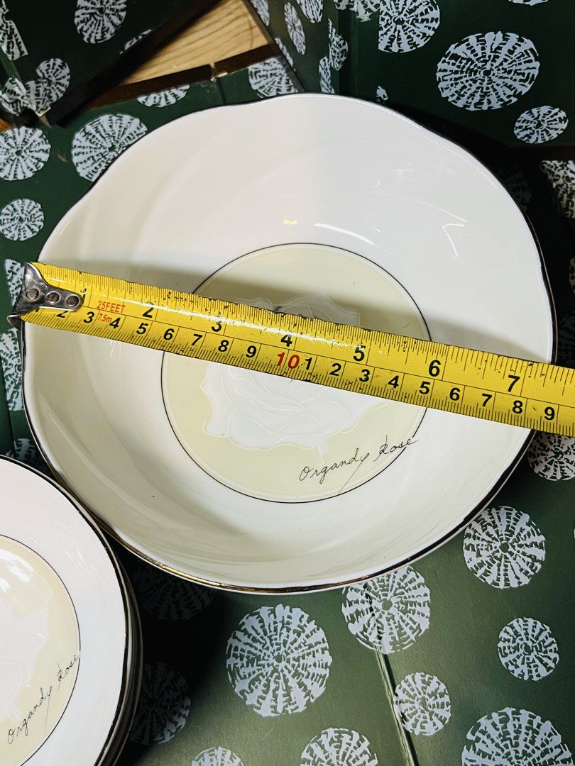 Organdy Rose Ceramic Bowls Set With Gold Trim (Category: Dinnerware & Cutlery) located in Malabon City. Submitted by mgsurplus (Listing ID 1468654701, Image 3). Description: - Elegant Organdy Rose ceramic dinnerware set - Includes 1 large serving bowl (approx. 7" across x 3" tall) and 3 smaller bowls (approx. 5" across) - Features a charming white glaze with pale yellow centers and delicate grey rose illustrations - Finished with luxurious metall