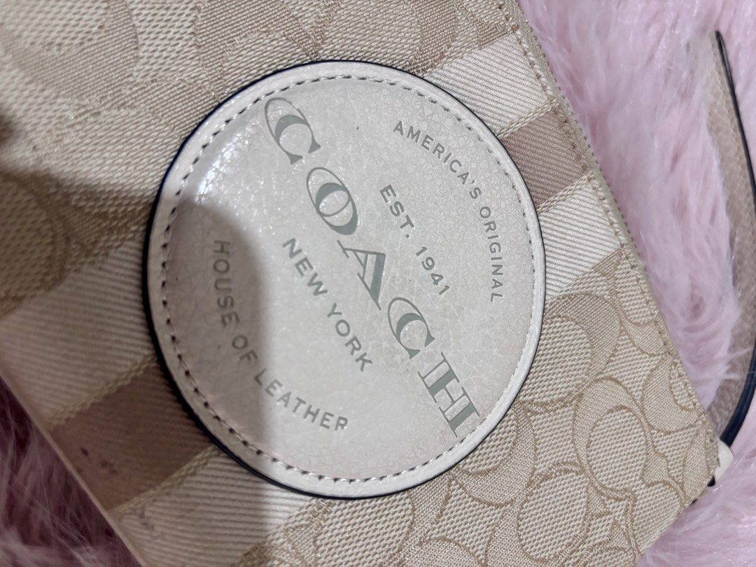 ORIGINAL COACH PURSE WALLET (Category: Purses & Pouches) located in Manila. Submitted by keyttttt_keyttttt (Listing ID 1468535064, Image 2). Description: Decluttering sale! Letting go of my original Coach purse bag. Perfect for anyone looking for a classy designer bag at a more affordable price! ✔️ 100% Original Coach ✔️ Good condition ✔️ Seldom used ✔️ With minimal flaw — may mantsa lang sa lower part ng purse ✔️ Still presentable and perfect fo