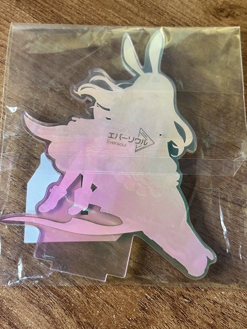 Original Eversoul Soonie Acrylic Standee Figure (Category: Designer & Blind Box Toys) located in Gapan. Submitted by lunashop14 (Listing ID 1468693442, Image 2). Description: - Official Eversoul merchandise - Character: Soonie (Pink hair, bunny ears design) - Includes base stand with printed character name - Japanese branding on the reverse side - Condition: Brand new, still sealed in original plastic packaging.