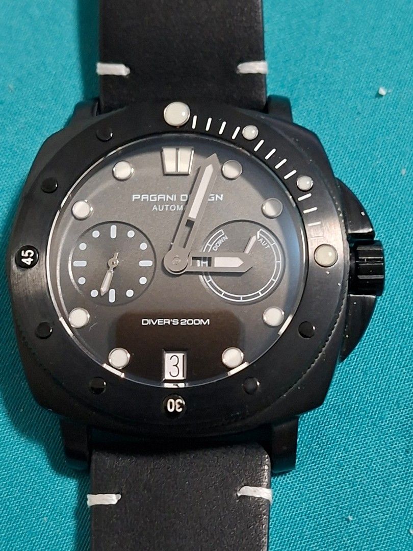 Pagani Design PD-1767 Automatic Diver Watch Black (Category: Men's Watches) located in Paranaque City. Submitted by tabsi76 (Listing ID 1468562079, Image 1). Description: - Brand/Model: Pagani Design PD-1767 Automatic Diver Watch - Case: Black stainless steel with exhibition caseback showing the automatic movement - Strap: Black leather with contrast white stitching - Dial: Gray dial featuring sub-dials and date window at 3 o'clock - Water Resist