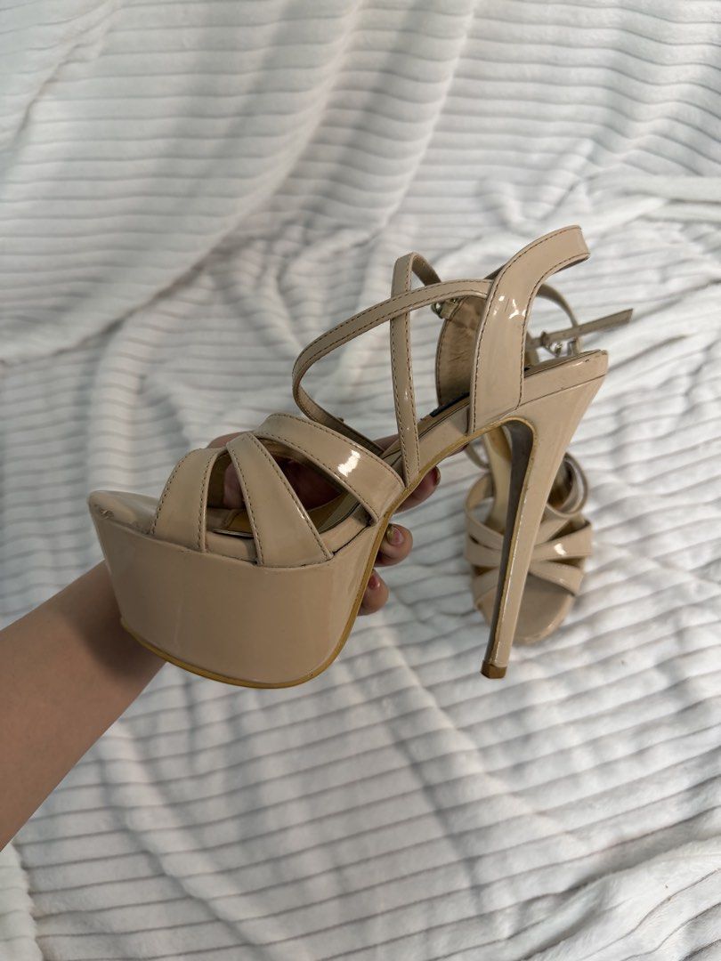 Pageant heels Nude Stiletto Heels (Category: Heels) located in Rizal. Submitted by kianapreloves (Listing ID 1468590689, Image 3). Description: - Color/Material: Nude patent leather - Style: High platform stiletto heels with strappy crisscross toe design and buckle ankle strap - Heel Height: Super tall - Condition: Worn a few times, minor signs of wear on the soles as shown in photos Rate: 8.5/10 Excellent Condition No issue .