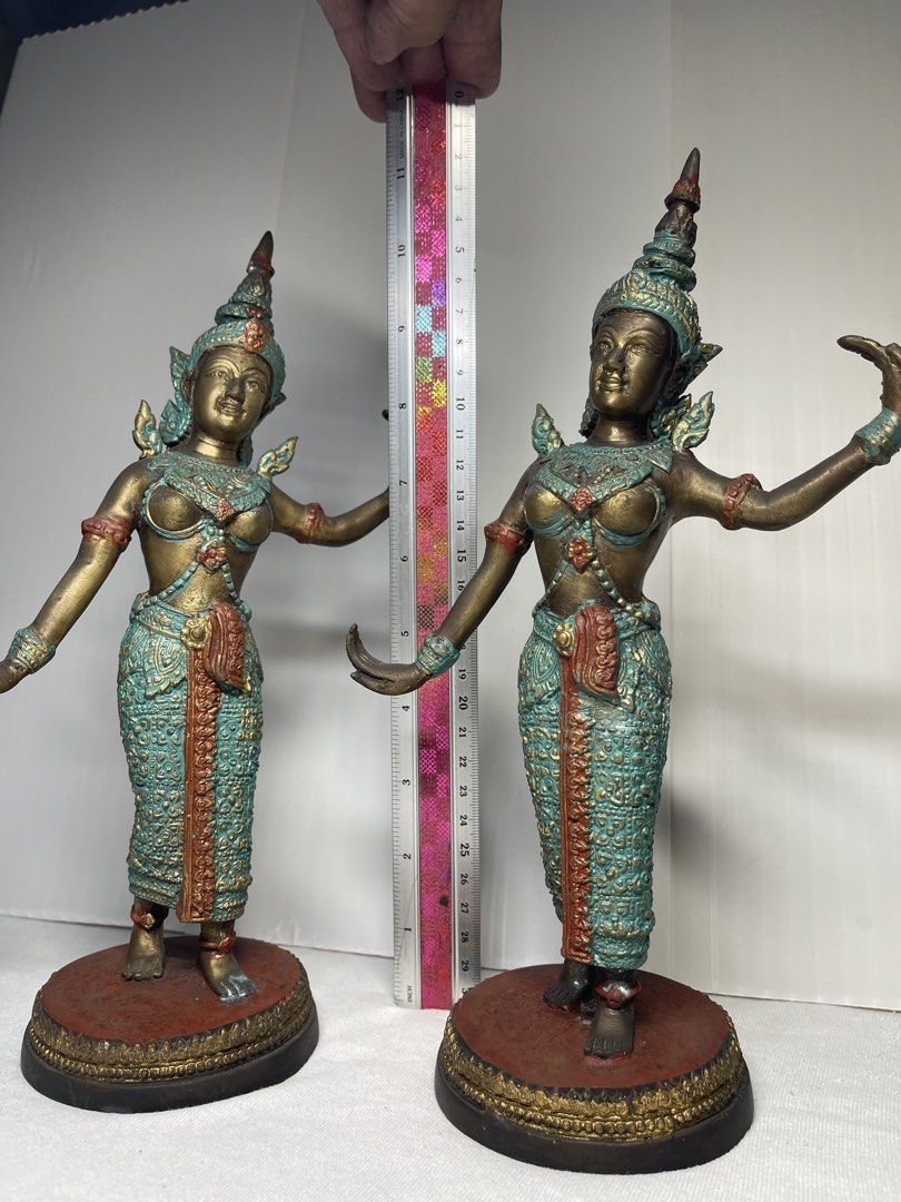 PAIR OF THAI-STYLE CLASSICAL DANCER STATUES (Category: Other Home Decor) located in Mandaluyong City. Submitted by coolmeybab (Listing ID 1468603838, Image 2). Description: Add an elegant touch of Southeast Asian artistry to your home with this beautiful pair of traditional Thai-style dancer figurines! ✨ Intricately detailed traditional costumes and headdresses ✨ Beautiful bronze-tone finish with turquoise-green and reddish accents ✨ Graceful dan