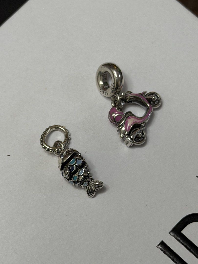 Pandora charms (check caption) (Category: Charms) located in Manila. Submitted by thekcollection (Listing ID 1468501880, Image 2). Description: AUTHENTIC PRELOVED PANDORA! 🛍️🛒 Pink retired murano charm - with signs of usage - 1250 Light blue -like new- 1450 Evil eye pink retired murano - minor signs of use - 1450 Fish charm - like new - 1900 Scooter - like new - 2500 No inclusions! All preloved. 100% money back if proven fake! negotiable. San P