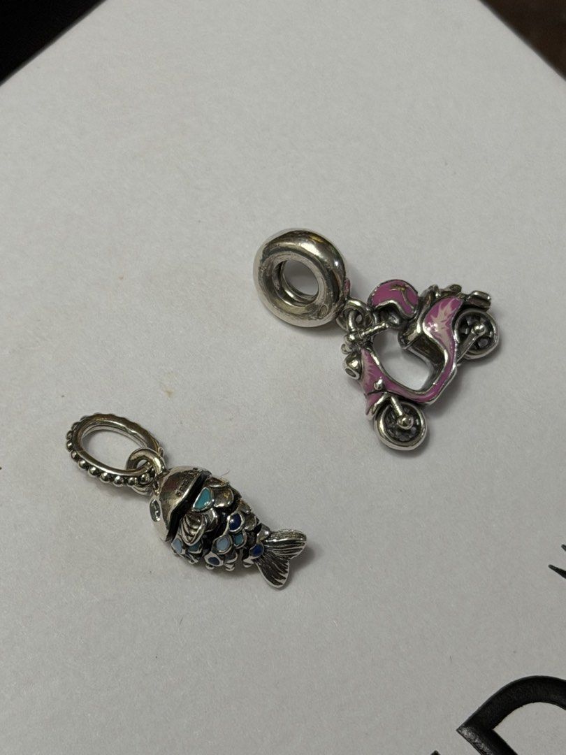 Pandora charms (check caption) (Category: Charms) located in Manila. Submitted by thekcollection (Listing ID 1468501880, Image 3). Description: AUTHENTIC PRELOVED PANDORA! 🛍️🛒 Pink retired murano charm - with signs of usage - 1250 Light blue -like new- 1450 Evil eye pink retired murano - minor signs of use - 1450 Fish charm - like new - 1900 Scooter - like new - 2500 No inclusions! All preloved. 100% money back if proven fake! negotiable. San P