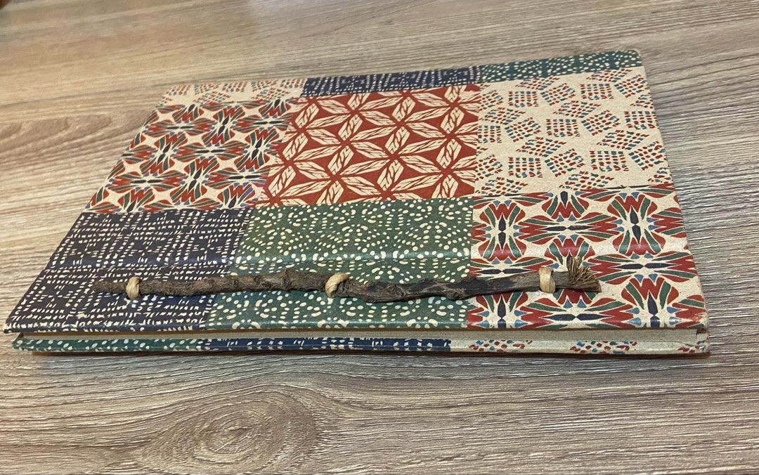 Papemelroti Handmade Patchwork Design Notebook (Category: Stationery & School Supplies) located in Manila. Submitted by jolinyaaa (Listing ID 1468681443, Image 3). Description: - Brand: Papemelroti (Authentic handmade artisan item) - Cover: Patchwork pattern with textured earth-toned paper panels - Closure: Rustic side twine binding - Pages: Clean, unused, and blank inside - Ideal for: Journaling, sketching, note-taking, or as a gift.