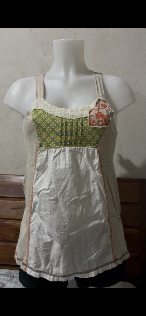Patchwork Tank Top Green White Orange Sleeveless (Category: Sleeveless) located in Bacolod City. Submitted by coco.mirren (Listing ID 1468679767, Image 1). Description: - Style: Quirky patchwork tank top with a relaxed fit and scoop neckline - Design: Green and yellow diamond pattern upper chest, orange floral accent on the strap, and white vertical striped lower half - Details: Neutral beige side panels and straps - Best for: Warm weather days a