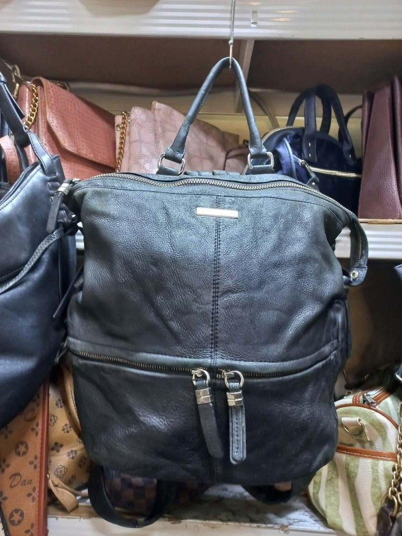 Patrice Bréal Black Leather Backpack (Category: Backpacks) located in Manila. Submitted by dei03_diz (Listing ID 1468692189, Image 1). Description: - Brand/Model: Patrice Bréal Black Leather Backpack - Exterior: Genuine black leather with top handle and dual shoulder straps - Pockets: Convenient front zipper pocket with double pullers - Interior: Patterned fabric lining with internal pockets, plus official leather and logo brand tags - Condition: