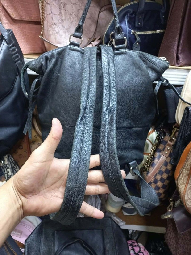 Patrice Bréal Black Leather Backpack (Category: Backpacks) located in Manila. Submitted by dei03_diz (Listing ID 1468692189, Image 2). Description: - Brand/Model: Patrice Bréal Black Leather Backpack - Exterior: Genuine black leather with top handle and dual shoulder straps - Pockets: Convenient front zipper pocket with double pullers - Interior: Patterned fabric lining with internal pockets, plus official leather and logo brand tags - Condition: