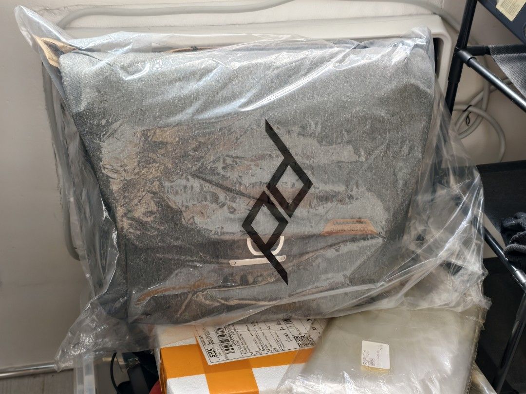 Peak Design Messenger Bag Ash Grey 13L bnew (Category: Sling Bags) located in Quezon City. Submitted by boldforest.76e99b (Listing ID 1468557876, Image 1). Description: - Brand: Peak Design Messenger Bag - Color: Ash Grey - Condition: Brand new, still sealed in original plastic wrapper (storage clearout) - Material: Sturdy, weather-resistant canvas - Features: Heavy-duty camera/gear carrier, adjustable strap included - Ideal for: Daily commutes a
