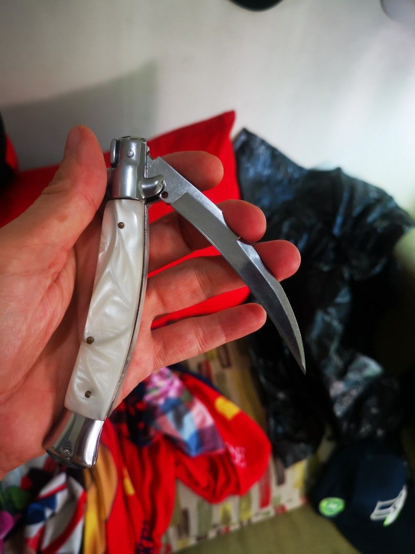 Pearl handle folding pocket knife with curved blade (Category: Knives & Chopping Boards) located in Pasay City. Submitted by wizemindz138970 (Listing ID 1468589397, Image 3). Description: - Elegant white pearlescent handle with shiny metal bolsters - Smooth-opening curved blade with a secure lock mechanism - Compact and pocket-friendly size for everyday carry - Solid, sturdy build that feels great in the hand - Clean condition with minimal signs 