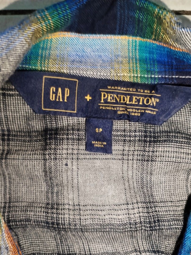 Pendleton polo (Category: Coats, Jackets and Outerwear) located in Baguio. Submitted by luxeloomarchive (Listing ID 1468547942, Image 2). Description: GAP x Pendleton Plaid Flannel Shirt (Size Small) ​Upgrade your style with this GAP + Pendleton collaboration button-down featuring a vibrant blue, green, and yellow plaid design. ​Brand: GAP x Pendleton ​Size: Small (SP) ​Details: Dual flap chest pockets, button-down front, soft flannel texture ​Co