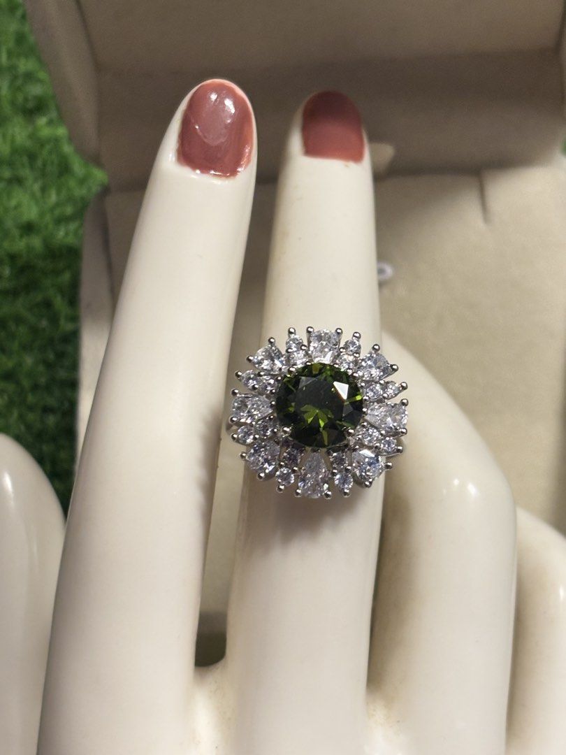 Peridot power ring gemstone (Category: Rings) located in Davao. Submitted by emmanuelchuamellorin23 (Listing ID 1468669044, Image 3). Description: 💚Peridot power ring gemstone Size7 adjustable Markings Au750 Rodium/ Platinum over copper based metal Tarnish resistant with extra care Message me directly📩.
