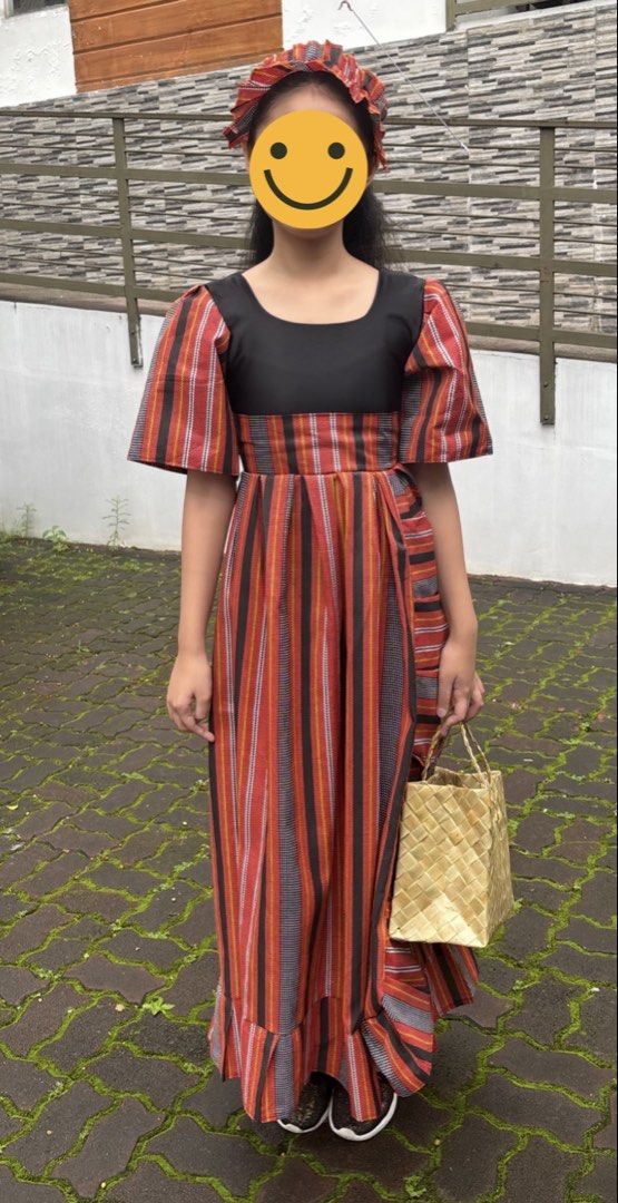 Philippines - UN Costume, 11 yrs old (Category: Babies & Kids Fashion) located in Marikina City. Submitted by theoldiesbutgoodies (Listing ID 1468678617, Image 1). Description: - Traditional Filipino ethnic print maxi dress - Features striking red, black, and orange vertical stripes - Short puff sleeves with a contrasting black sweetheart neckline - Flared hem for a graceful, flowing look - Complete set: includes a matching headband and woven rat