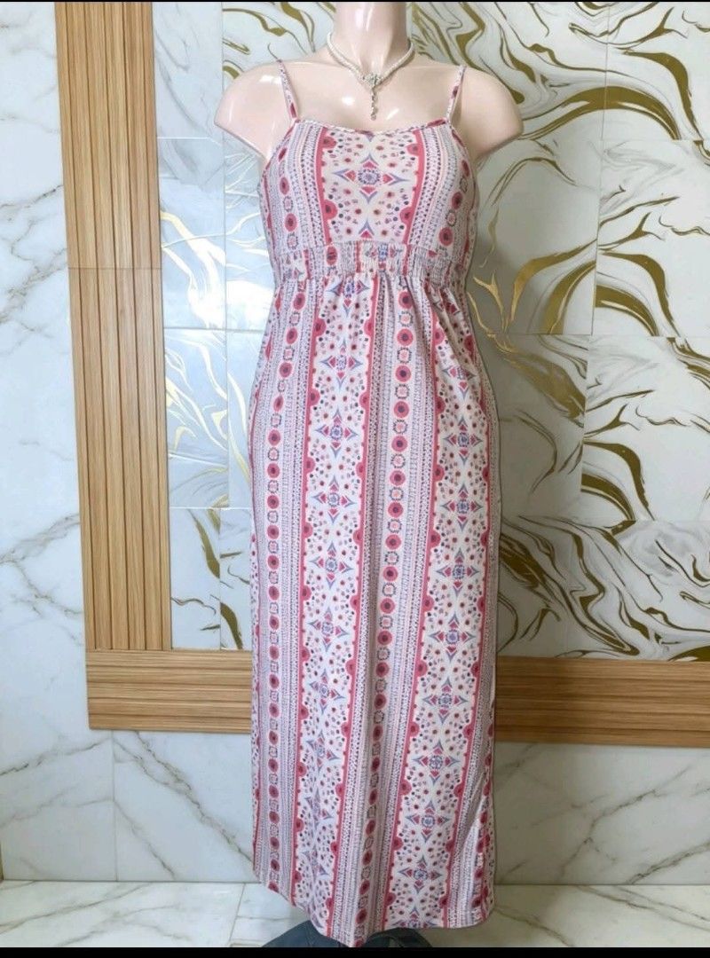 Pink and White Patterned Sleeveless Long Dress (Category: Dresses) located in Santa Rosa. Submitted by margaux022 (Listing ID 1468560063, Image 1). Description: - Color/Pattern: Pink and white with geometric and floral vertical stripes - Design: Spaghetti straps, straight neckline, and a stretchy smocked bodice - Length: Floor-length maxi - Material: Lightweight fabric - Best For: Warm weather, casual days out, and effortless styling.