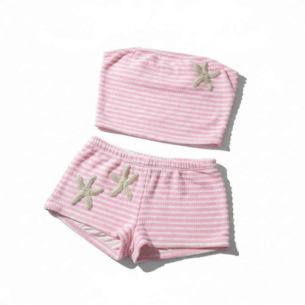 Pink and White Striped Starfish Bikini Set (Category: Bikinis & Swimsuits) located in Calapan. Submitted by fandolis (Listing ID 1468538172, Image 2). Description: - Pink and white striped strapless bandeau top and matching shorts - Features adorable knitted starfish patches on the top and shorts - Made from a soft, textured terrycloth fabric - True to size and super comfortable for warm summer days - Perfect for trips to the beach or lounging by