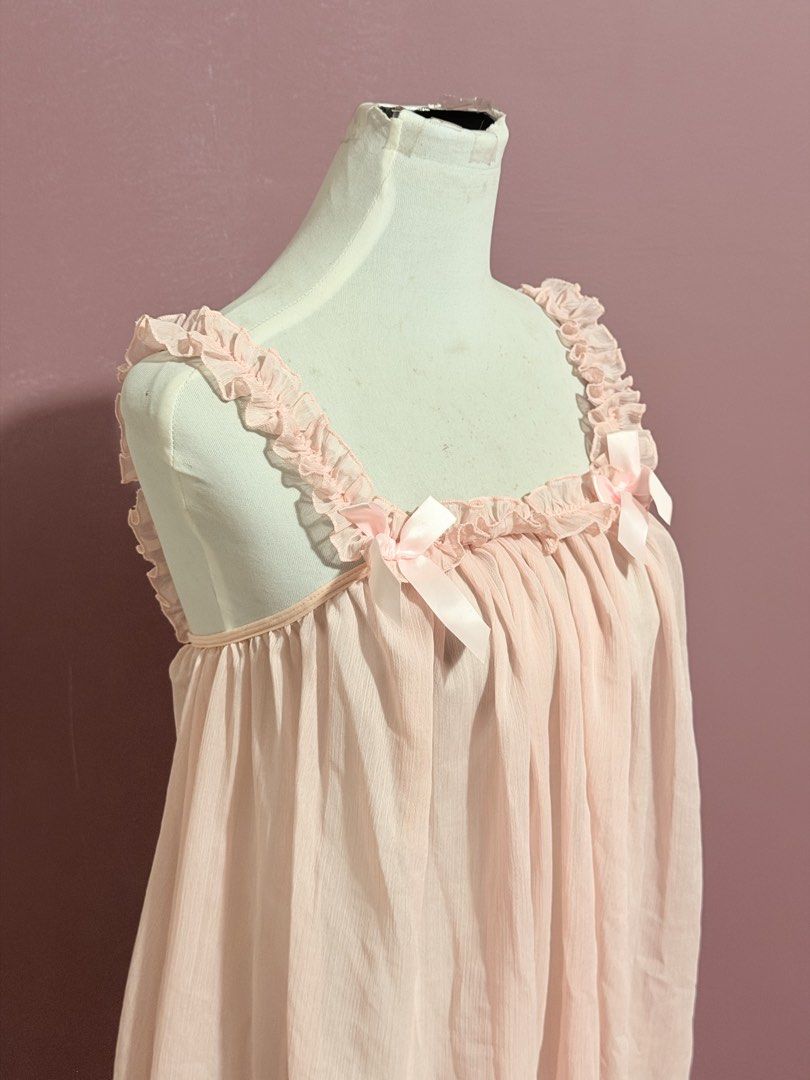 Pink Chiffon Nightgown with Ruffled Straps (Category: Dresses) located in Manila. Submitted by thatgirl0001 (Listing ID 1468686896, Image 3). Description: - Color: Light pink - Material: Lightweight, sheer chiffon - Fit: Flowy and comfortable slip-on design - Details: Cute ruffled straps and two small bows at the neckline - Perfect for: Cozy loungewear or sleepwear.