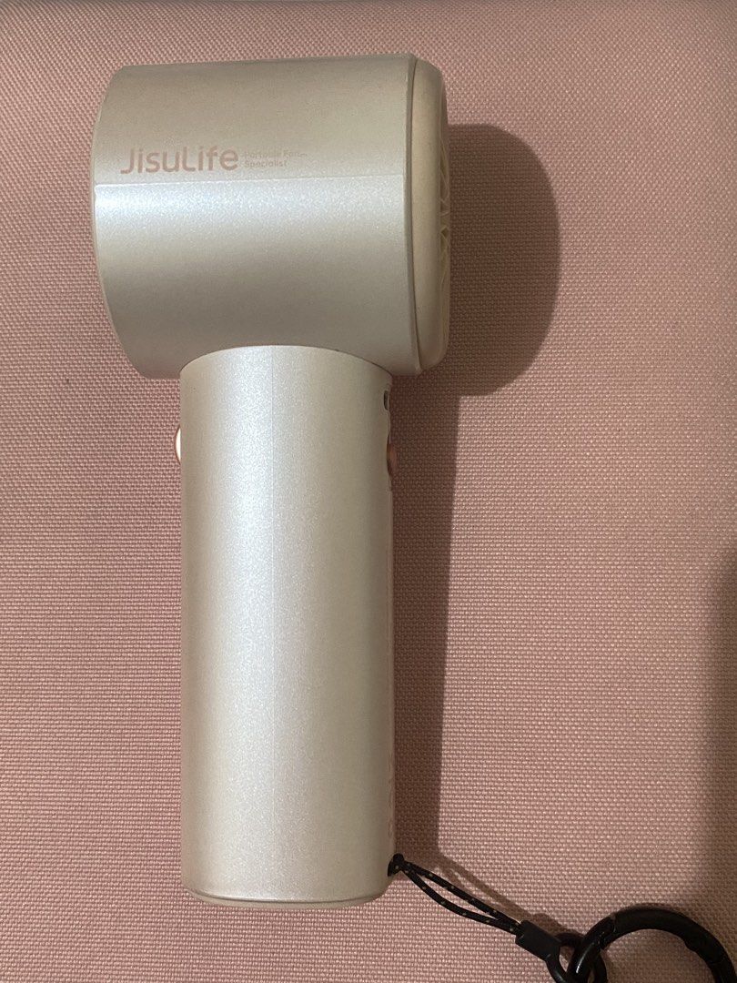 Pink Jisulife Fan Pro1 (Category: Fans) located in Manila. Submitted by ccinh09135 (Listing ID 1468679902, Image 2). Description: 📍Sampaloc Manila - Model: Jisulife Handheld Fan Pro1 - Color: Pink - Store price: ₱2,114 - Condition: Clean body with minimal signs of wear - comes with type C cord and drawstring mini bag (no box).
