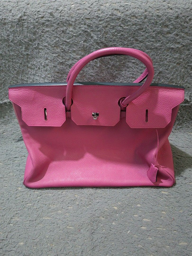 Pink Leather Handbag Tote (Category: Tote Bags) located in Las Pinas. Submitted by huslerz (Listing ID 1468543729, Image 1). Description: -hermes berkin bag Color & Material: Bright pink leather - Design: Structured body, top handles, flap closure, and silver hardware with metal bottom feet - Functionality: Great daily carryall bag that maintains its structured shape.