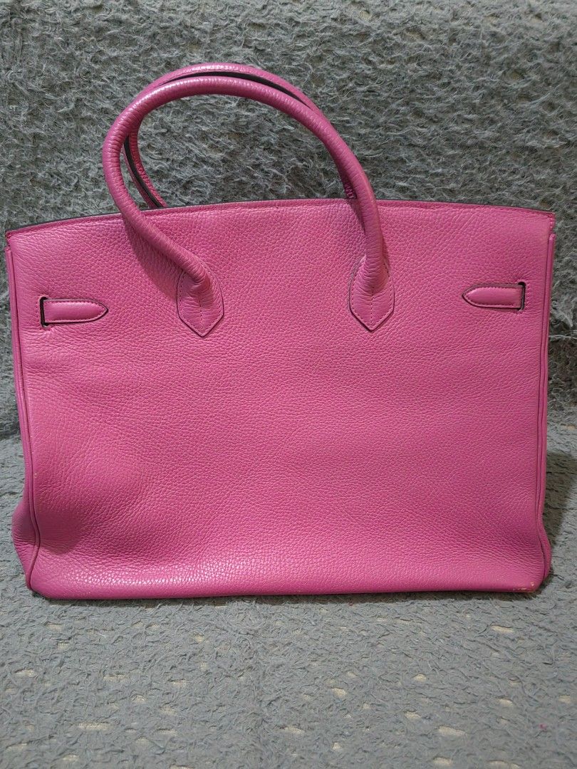 Pink Leather Handbag Tote (Category: Tote Bags) located in Las Pinas. Submitted by huslerz (Listing ID 1468543729, Image 3). Description: -hermes berkin bag Color & Material: Bright pink leather - Design: Structured body, top handles, flap closure, and silver hardware with metal bottom feet - Functionality: Great daily carryall bag that maintains its structured shape.