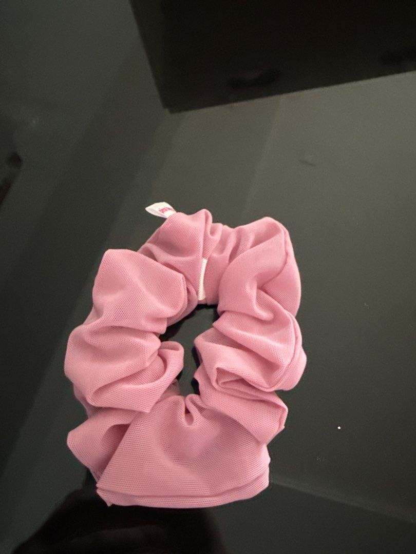 Pink Mesh Hair Scrunchie (Category: Hair Accessories) located in Mandaluyong City. Submitted by declutteringmylife101 (Listing ID 1468570996, Image 1). Description: - Color: Pastel pink - Material: Sheer mesh fabric with stretch elastic inside - Features: Secure hold without pulling, lightweight, subtle white brand tag - Usage: Ideal for daily ponytails and buns.