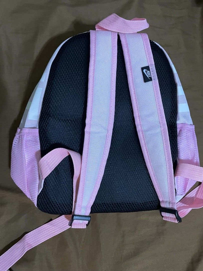 Pink Nike Backpack With Just Do It Keychain (Category: Backpacks) located in Iloilo. Submitted by lovedbymyl (Listing ID 1468601256, Image 3). Description: Nike Brasilia Mini Backpack – Pink Pretty in pink! 🎀— Light pink with a white swoosh logo • Almost brand new— Only opened, with the tag already cut (bought last week) • Cute, compact, and perfect for everyday use— can be used by adults & kids𐔌՞ ܸ.ˬ.ܸ՞𐦯 •Includes: main zipper compartment, fr