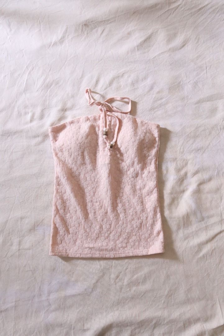 Pink Textured Halter Top with Beaded Strings (Category: Sleeveless) located in Manila. Submitted by imama23 (Listing ID 1468535604, Image 1). Description: - Color: Light pink - Details: Adjustable neck ties adorned with padded front Condition: 9/10 Size: XS-S Location: Manila Shipping - Payment first before shipping - J&T, Grab, Lalamove (Buyer may choose preferred courier) - MOP: GCASH, Bank Transfer - Shipping to be shouldered by buyer .