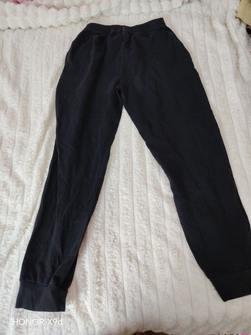 Plain Black Jogger Pants with Cuffs (Category: Other Bottoms) located in Mabalacat. Submitted by Jackikay.PreLoved (Listing ID 1468504687, Image 2). Description: Solid black jogger pants in a comfortable, soft material. Features an elastic waistband, fitted ankle cuffs, and a basic design that easily matches any t-shirt or hoodie. Perfect for lounging or casual wear..