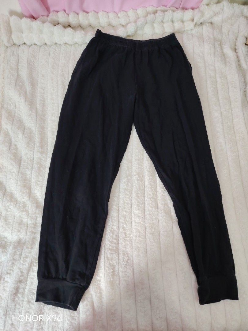 Plain Black Jogger Pants with Cuffs (Category: Other Bottoms) located in Mabalacat. Submitted by Jackikay.PreLoved (Listing ID 1468504687, Image 1). Description: Solid black jogger pants in a comfortable, soft material. Features an elastic waistband, fitted ankle cuffs, and a basic design that easily matches any t-shirt or hoodie. Perfect for lounging or casual wear..