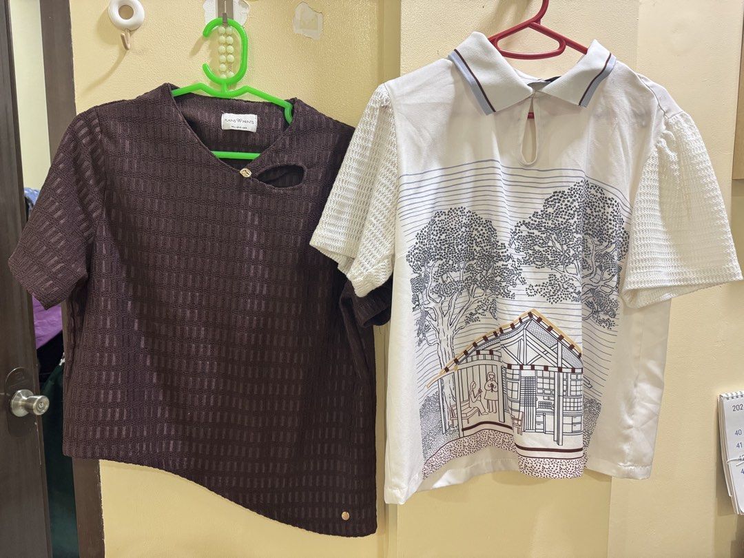 Plains & Prints Tops Buy 1 take 1 (Category: Blouses) located in Iba. Submitted by geliqq (Listing ID 1468657403, Image 2). Description: - Bundle of 2 stylish short-sleeve shirts in clean, ready-to-wear condition - Shirt 1: Dark brown Plains & Prints top with a unique textured pattern and asymmetrical hem - Shirt 2: White top featuring textured sleeves, a collared keyhole neckline, and a detailed house and tree graphic - Versatile designs that pa